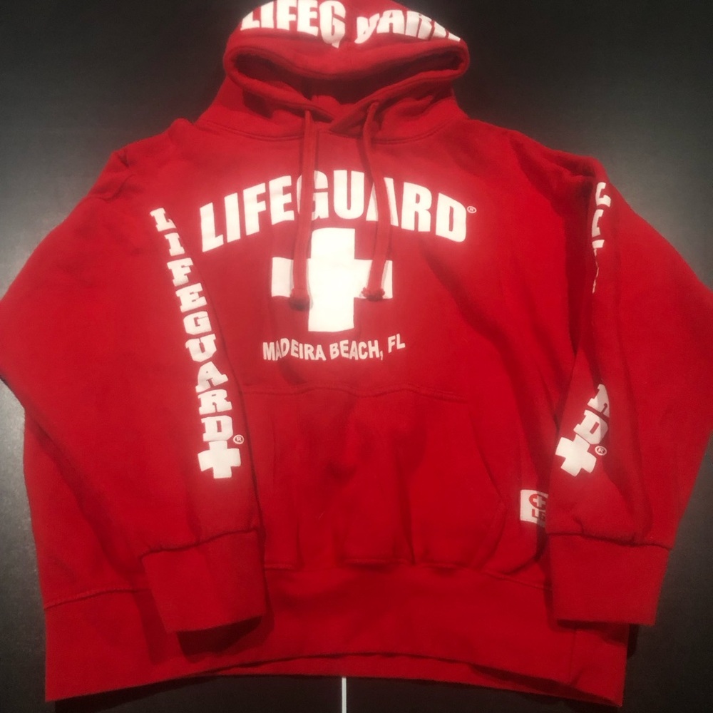 Red and white Lifeguard sweatshirt.